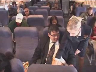 stewardess masturbates dick to an airplane passenger